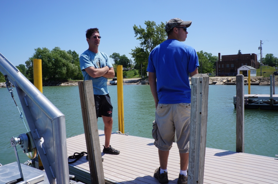 Two people standing on a dock